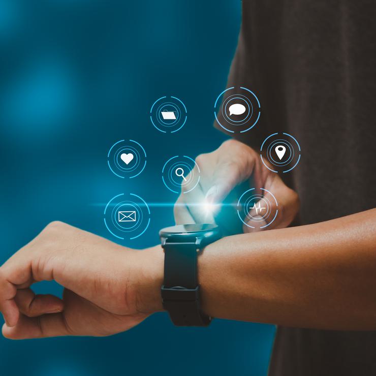 Man with smart watch checks results.
