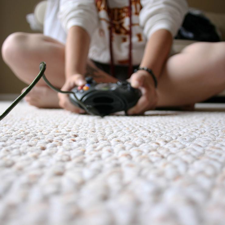 Photo of child playing a video game by Chapendra from Flickr