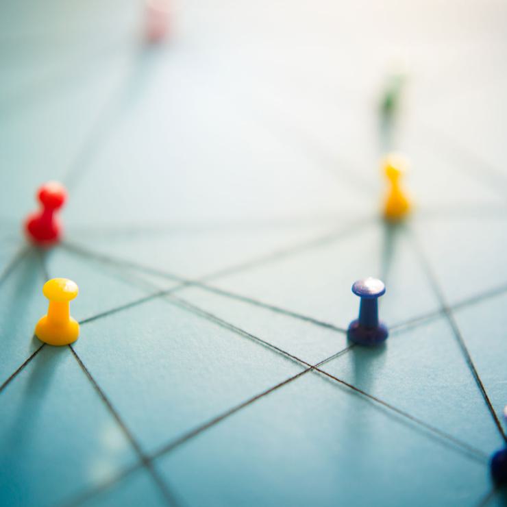 Pushpins Connecting String To Depict Neural Connection In The Brain